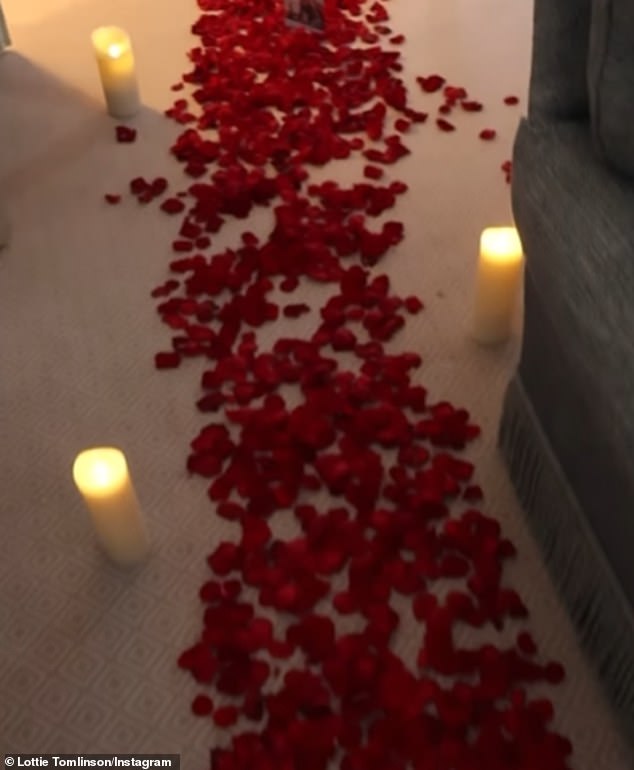 Lewis had covered the floor with red rose petals and lit candles