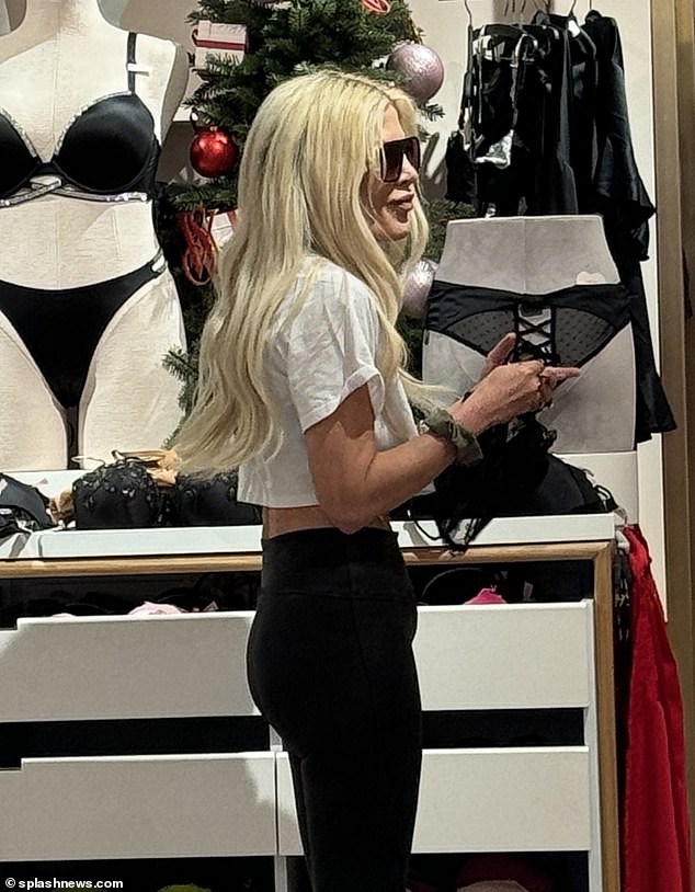 On a mission!  The star clearly had lingerie in mind as she passed by two intimate shops