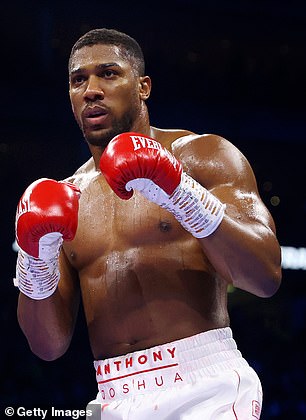 Anthony Joshua watches during the heavyweight fight between Anthony Joshua and Jermaine Franklin at the O2 Arena