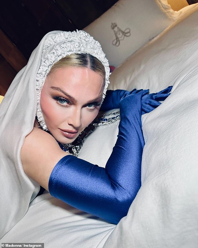 Blue: Madonna's blue eyes were accentuated by her royal blue opera gloves and the blue beads of one of the rosaries she accessorized with