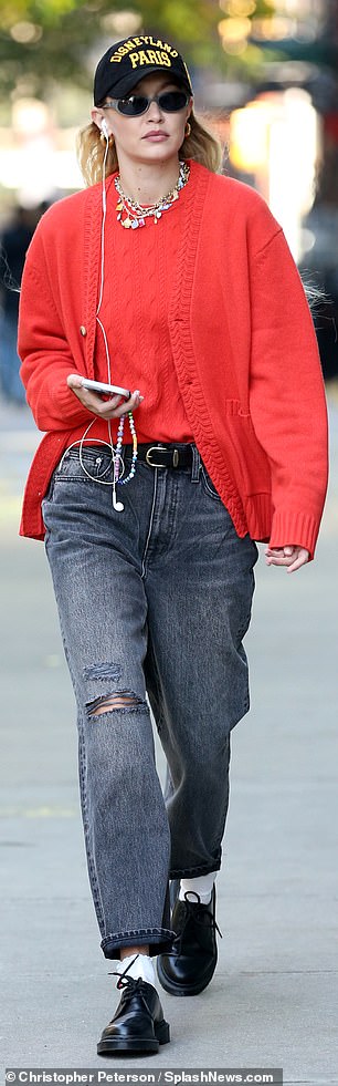 Well paired: Hadid contrasted the vibrant color of her tops with a pair of lightly distressed and dark gray cuffed jeans