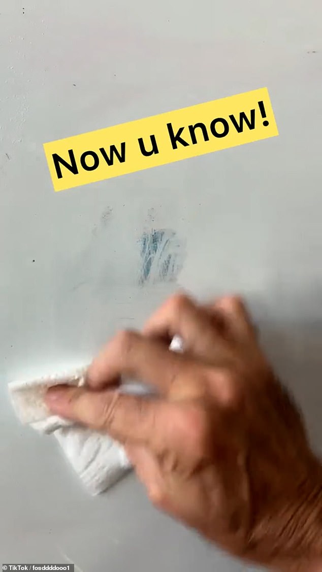 Instead of trying to rub out the text with glass cleaner, the user successfully removes any trace of the highlighter after using a whiteboard eraser pen to draw over the stain before wiping it clean