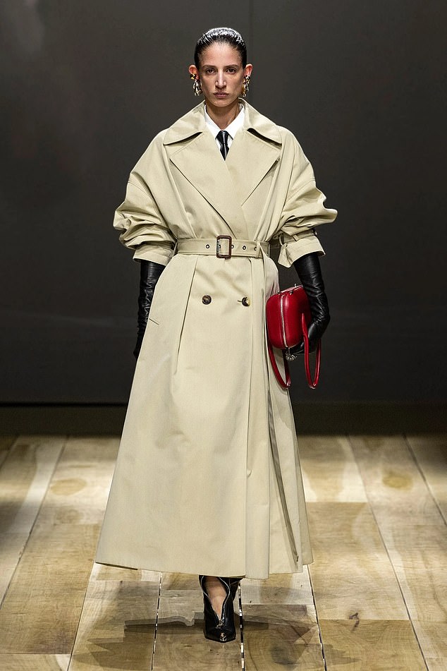 Alexander McQueen's version of the iconic trench coat is just as tailored.  You could easily spot it in Diana's wardrobe