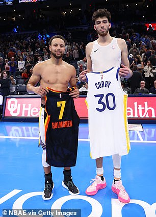 After catching Holmgren (right) napping, Curry (left) traded jerseys with the rookie