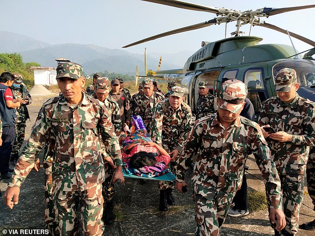 Local television broadcast images of troops recovering bodies while others helped dig out and carry the wounded