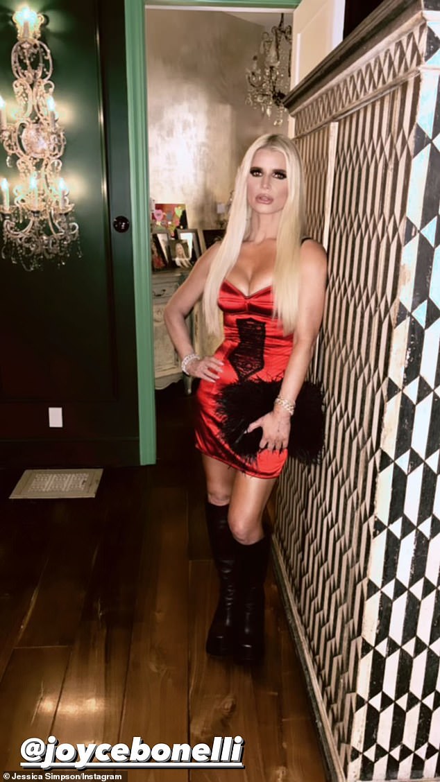 Sultry display: She showed off her bustiness in a very low-cut, figure-hugging satin mini dress with a black lace detail at the center of her waist.  Simpson shared several photos and videos showing off her bombshell look and also reposted celebrity makeup artist Joyce Bonelli