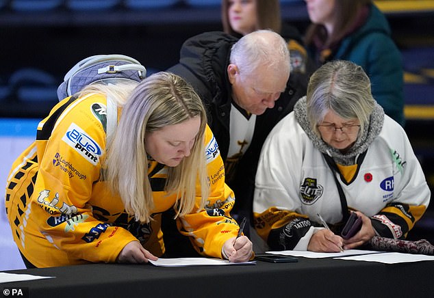 Many fans lined up to sign a book of condolence that was also present in the arena