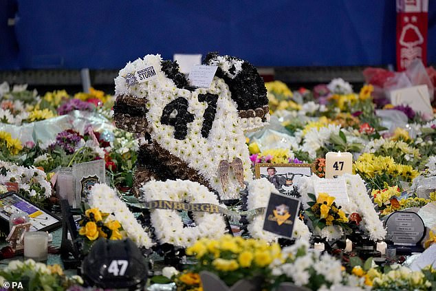 Outside, there were floral tributes for the American star, including candles and messages