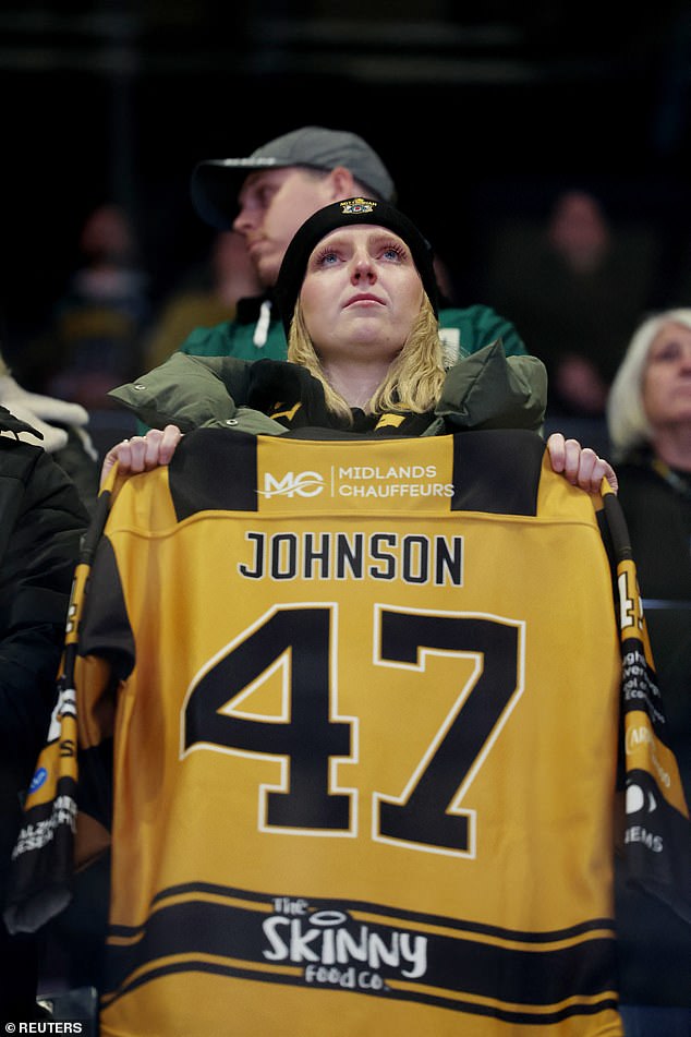 Many fans held up or wore Johnson's jersey on an emotional night for the hockey community