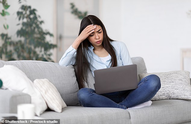 About 67 percent of hybrid workers have a 'sneak suspicion' that on-site staff will have better opportunities.  In the photo: a worried-looking woman working from home