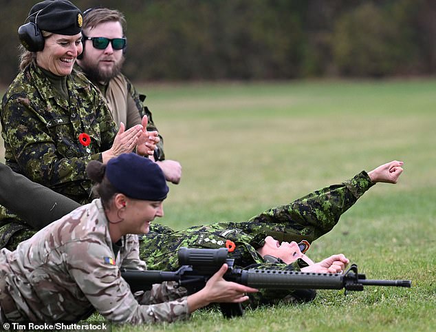 The royal mother of two raised her fist in the air as she celebrated her success in the shooting challenge