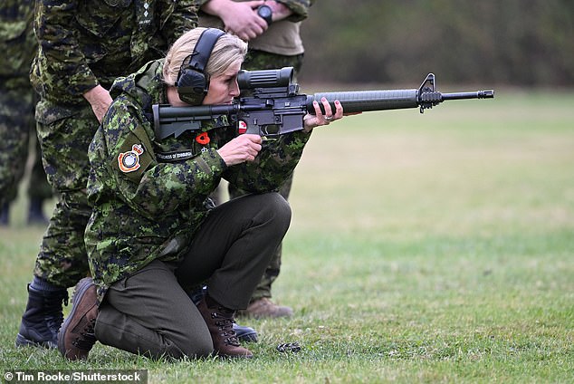 The Duchess appeared focused as she got down on one knee and took part in the target practice