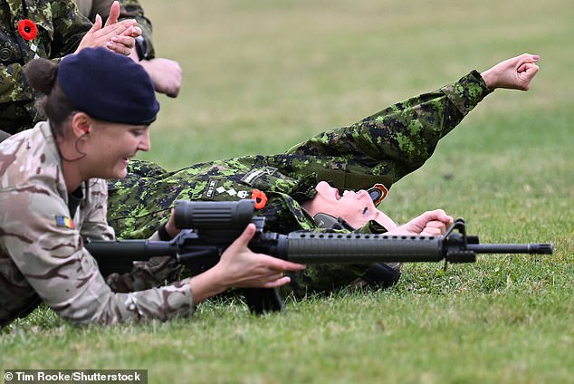 Sophie raised her fist in the air as she celebrated victory during the target practice shooting range