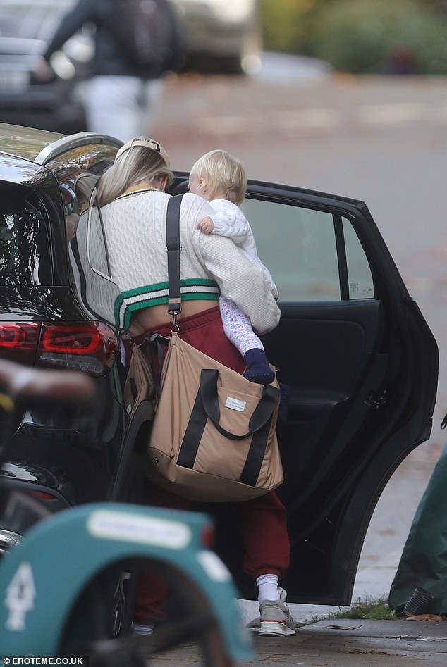 Solo: Chloe was pictured putting Bodhi into her car seat before heading out together