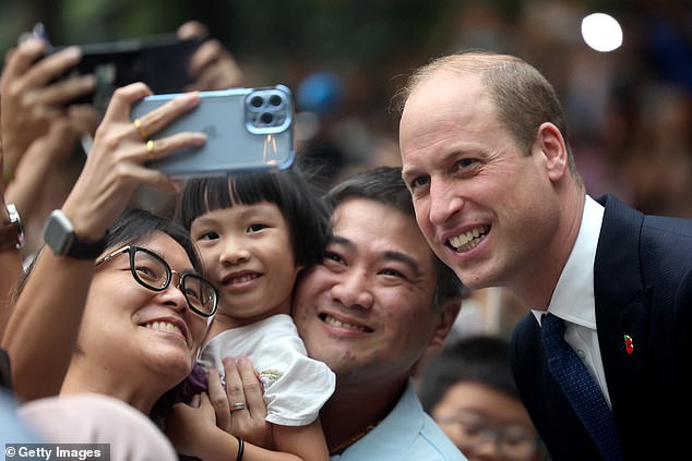 He chatted with children and took selfies with those eagerly lining the airport as he walked with Sim Ann, the country's foreign minister.