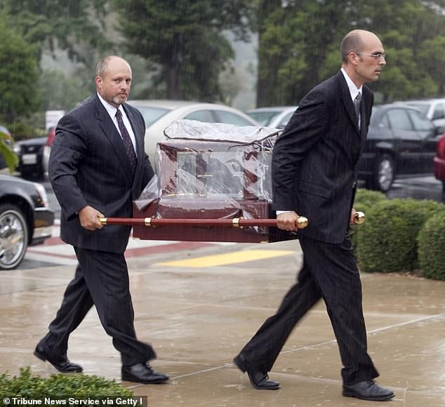 Lauren's torso, which had been placed in a black garbage bag, was found dumped in a garbage bin near her apartment.  Pictured: Pall pallbearers carrying her remains to her funeral service