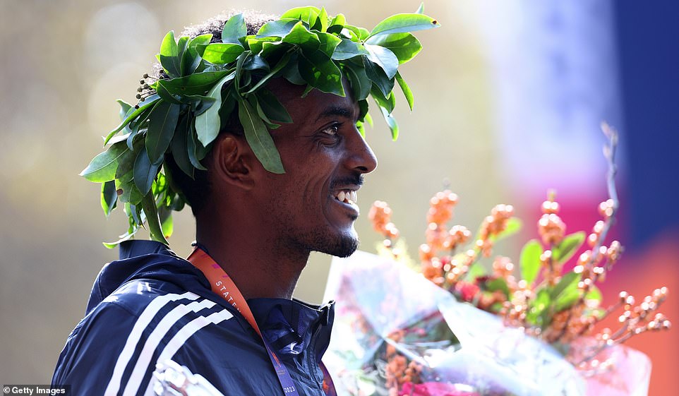 Tola, 32, topped Geoffrey Mutai's 2:05:06 in '11.  In the photo: Tola celebrates after setting a course record with his victory