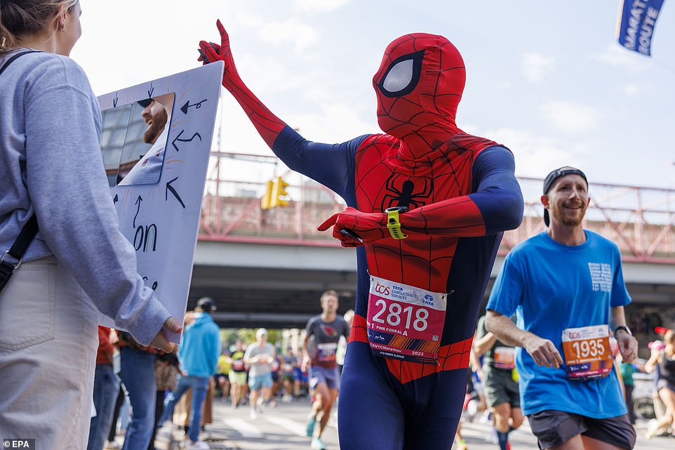 FRIENDLY NEIGHBORHOOD SPIDER-MAN: A runner dressed as the Marvel superhero as he interacted with onlookers in NYC