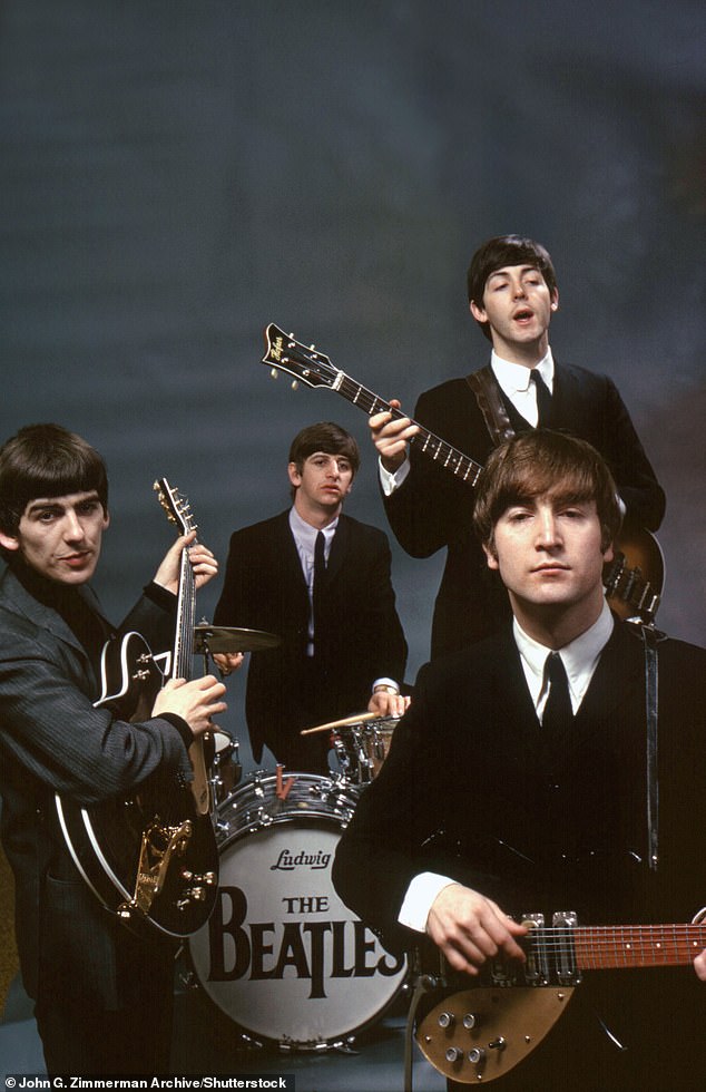 The Fab Four: (clockwise from far left) George Harrison, Ringo Starr (on drums), Sir Paul McCartney, John Lennon in New York in 1964