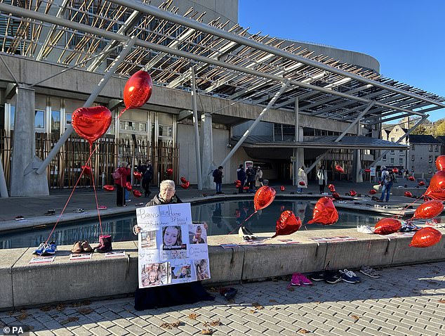 Images of the hostages were also on display as many gathered to pay their respects