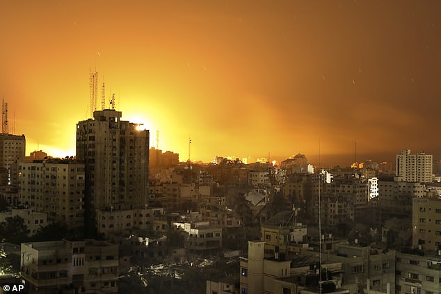 Fire and smoke rise from buildings after Israeli airstrikes on Gaza City, Sunday, November 5