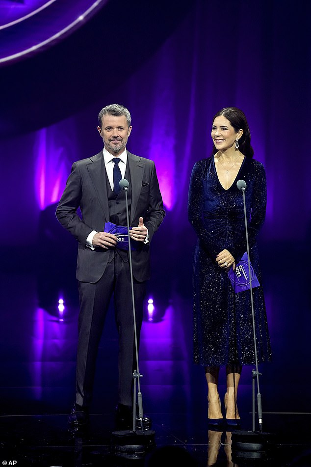 Frederik looked dapper in a gray tuxedo, matching colored vest and white button-up shirt for the event