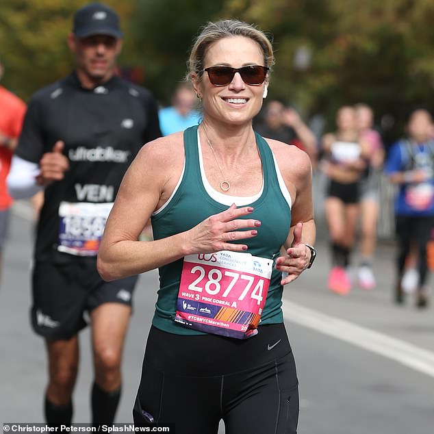 Robach wore a green tank top and black Nike leggings, along with sunglasses