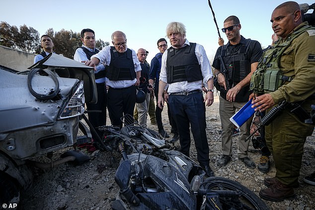 Scott Morrison and Boris Johnson visit Kibbutz Kfar Azar in southern Israel