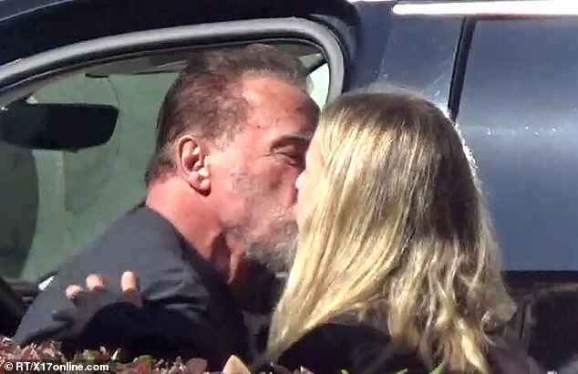 The bodybuilding icon and the mystery woman had a quick hug before he left