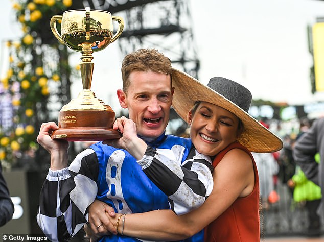 Jockey Mark Zahra is congratulated by his wife Elyse after riding Gold Trip to victory in the 2022 Melbourne Cup. This year the horse is aiming for two in a row