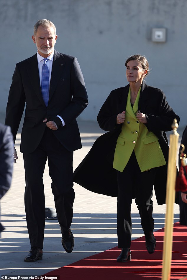 Perhaps the most eye-catching part of her ensemble was a stunning blazer in neon green fabric, with a v-neck and shiny gold buttons down the front.