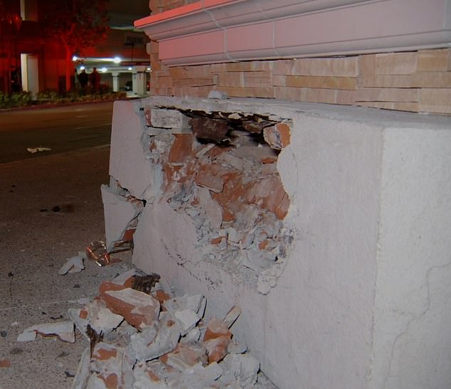 The white Honda SUV came to a stop when it hit the wall of Black and Blue's patio