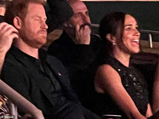 Rubbing shoulders with royalty: The singer, 55, sat in the VIP section next to Meghan and Prince Harry as she enjoyed a rare outing amid her battle with Moersch-Woltman syndrome