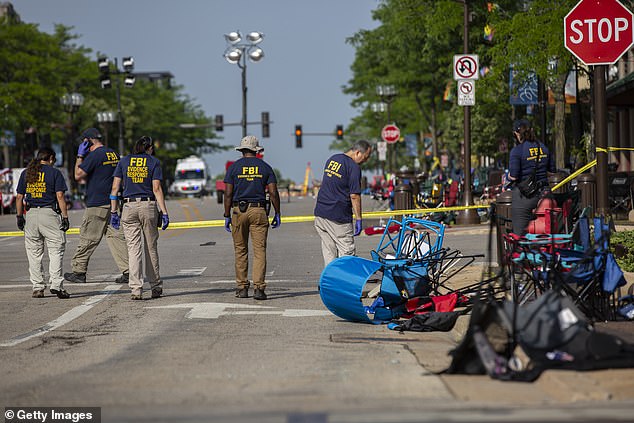 FBI agents on scene a day after 22-year-old suspect opened fire during the July 4, 2022, parade in suburban Highland Park, Illinois, killing seven and injuring dozens