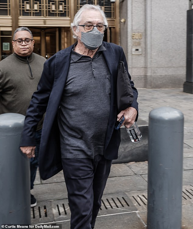 The photo shows De Niro leaving the court last Thursday.  Robinson, his former executive assistant, has sued him for $12 million for sexual discrimination and retaliation.  He denies these allegations and has sued Robinson for $6 million