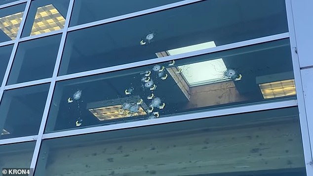 Bullet holes litter the windows of the Toyota of Berkeley Certified Service Center in Berkeley