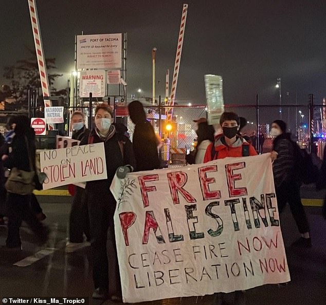 Many protesters in Tacoma showed up with signs reading 