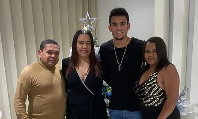 The Liverpool star's mother (above in 2019, center left) was rescued after the pair were snatched from the streets of Colombia last week, but his father's whereabouts remain unknown