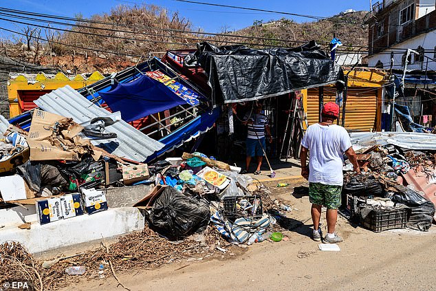 Entrepreneurs inventory the damage caused by Hurricane Otis at a company in Acapulco