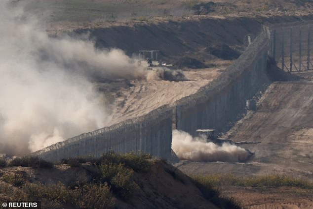 Israeli tanks cross the border from the Gaza Strip into southern Israel