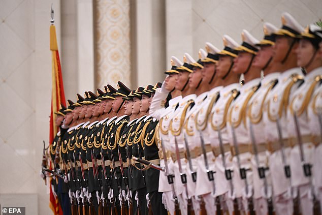 A military band played both the Chinese and Australian national anthems during the ceremony, as 144 soldiers stood at attention with their bayonets at their sides