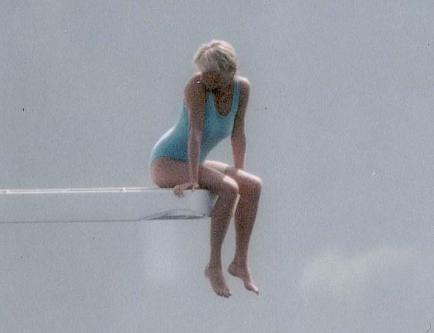 Iconic scene: A photo of the late Princess of Wales shows her in a turquoise swimsuit as she stands elegantly on the edge of a diving board in Portofino