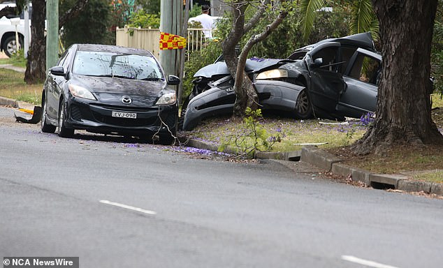 Braydan Collier, 13, and Kaine Bell, 14, were traveling in a gray Ford Falcon sedan that crashed into a tree and utility pole on Monday (pictured)