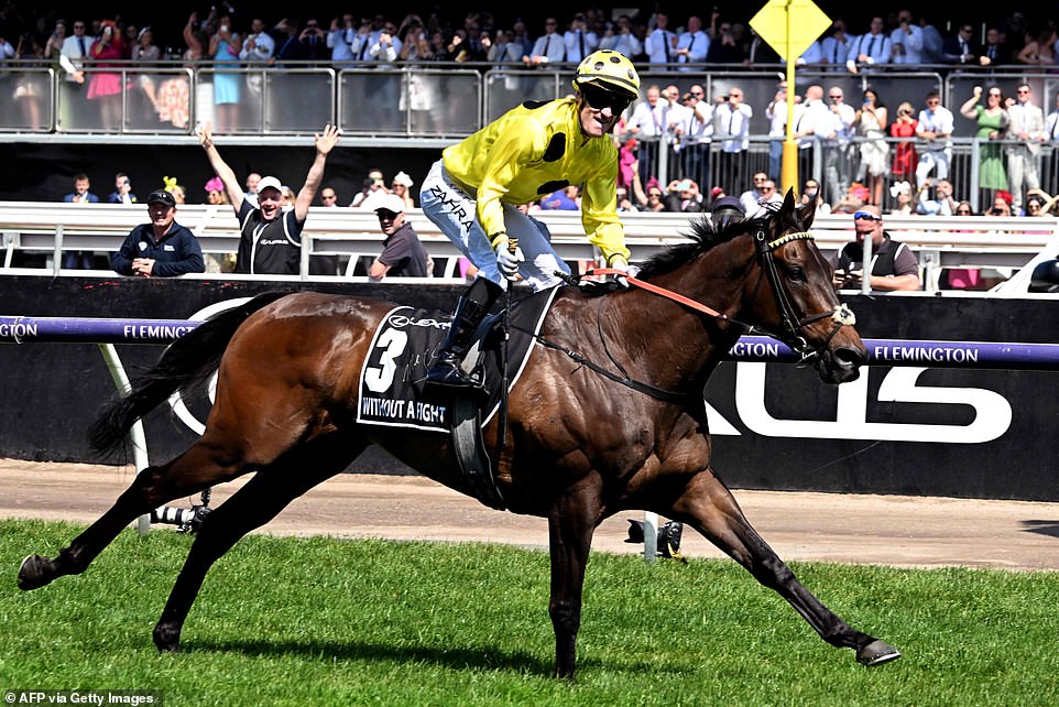 Jockey Mark Zahra celebrates victory on his horse Without A Fight in $8.4 million race that holds back a nation