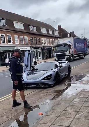 The star striker arrived in the nick of time as a parking attendant hovered ominously, before driving away in the £280,000 supercar.