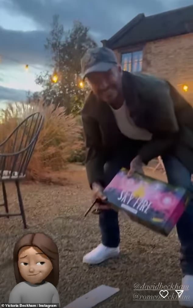 Ready to go: David spent the evening with his wife Victoria and children Harper, 12, and Romeo, 21, setting off fireworks in their garden