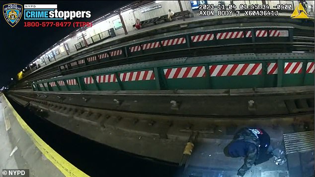 They saw a man on his hands and knees on the subway tracks