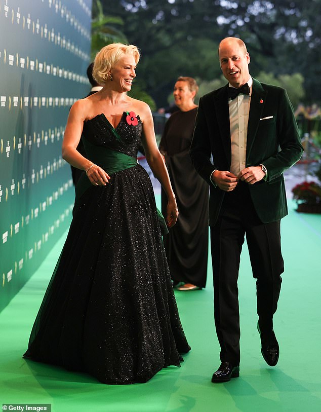 William wore a sharp emerald green velvet jacket and bow tie, while the Ted Lasso star wore an elegant black ball gown with an emerald green sash - as the pair strolled across a green carpet for the 2023 Earthshot Prize Awards ceremony