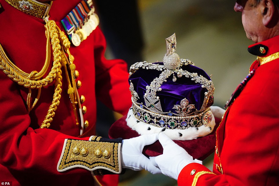 The Imperial State Crown arrives at the Sovereign's entrance to the Palace of Westminster, prior to the State Opening of Parliament