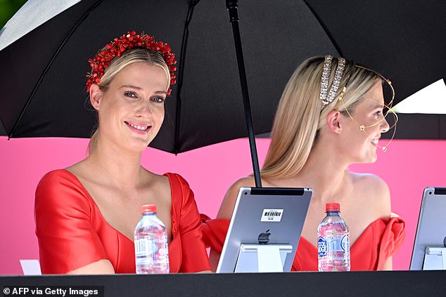 Lady Amelia Spencer (left) and Lady Eliza Spencer, nieces of the late Princess Diana, judge the competitors during the 'Fashions in the Field' event before the start of the Melbourne Cup horse race